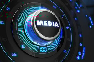 Media Button with Glowing Blue Lights on Black Console.