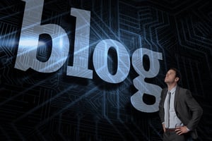 The word blog and serious businessman with hands on hips against futuristic black and blue background