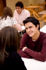 couple looking happy and relaxed talking in a restaurant-1