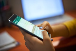 girl-typing-phone-message-on-social-network-at-nig-2021-08-26-15-46-10-utc (1)