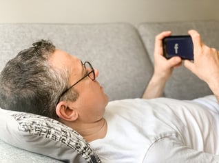 middle-aged-adult-man-opening-facebook-social-medi-2022-11-15-23-42-20-utc